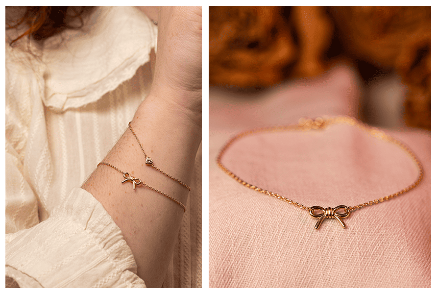 Złota bransoletka z kokardką na ręce – delikatny łańcuszek i minimalistyczna zawieszka, zbliżenie produktu