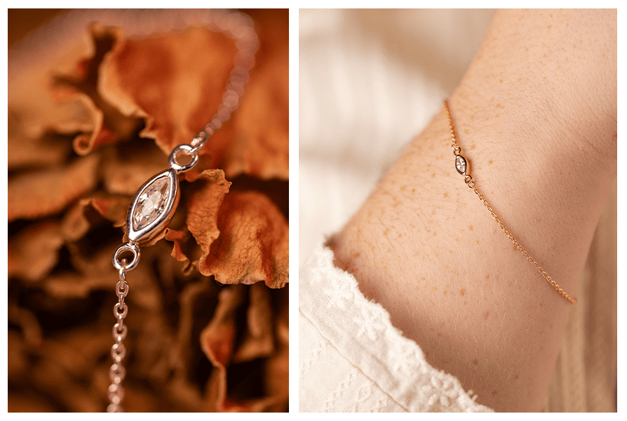 Detal cyrkonii markiza na łańcuszku na tle suszonych liści; obok bransoletka na ręce w ciepłej, jasnej stylizacji