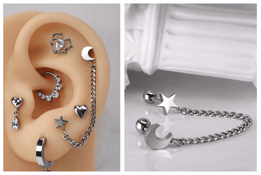 Kolczyk do ucha do dwóch przekłuć w srebrnym kolorze z ozdobnym łańcuszkiem łączącym gwiazdkę i księżyc, zaprezentowany w zbliżeniu na uchu z silikonu oraz jako produkt na białym tle