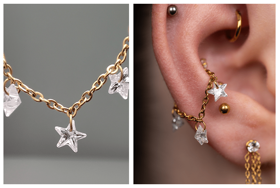 Łańcuszek do piercingu z trzema kryształowymi gwiazdkami – detal ogniw oraz ucho z kilkoma przekłuciami ozdobionymi tym łańcuszkiem