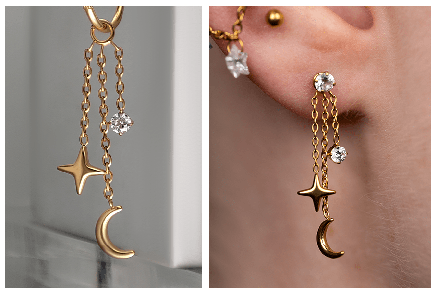 Złoty łańcuszek księżyc z gwiazdką i kryształkiem do kolczyków – zbliżenie na wiszący kolczyk oraz ucho z założoną biżuterią