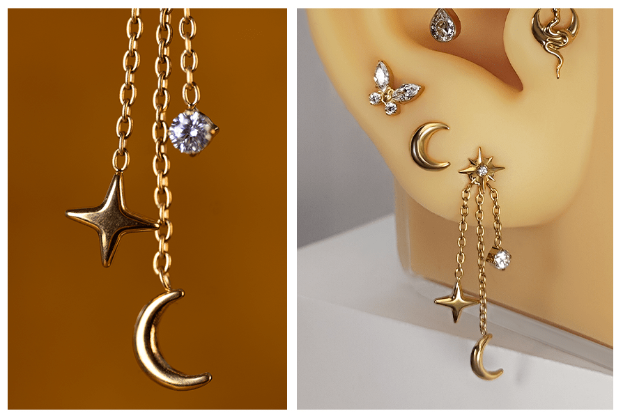 Złoty łańcuszek księżyc z gwiazdką i kryształkiem, pokazany w zbliżeniu na tle w kolorze złota oraz na modelu ucha z kilkoma kolczykami