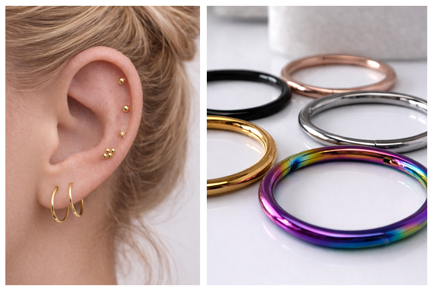 Na uchu widać dwa złote kółka i drobne kolczyki, a obok leżą stalowe kółka clicker w kolorze czarnym, złotym, srebrnym, różowego złota i tęczowym