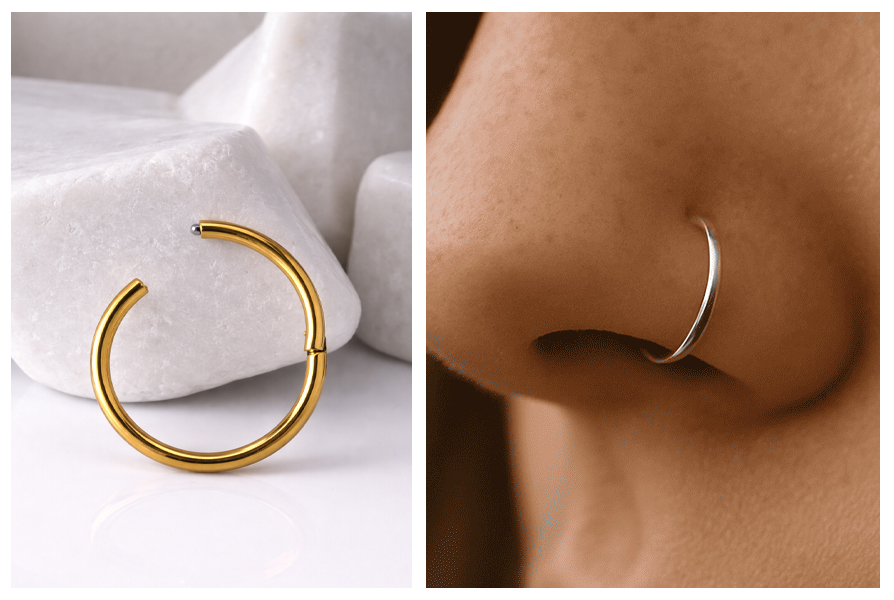 Złote kółko clicker na białym tle, a obok srebrne kółko jest założone w skrzydełku nosa