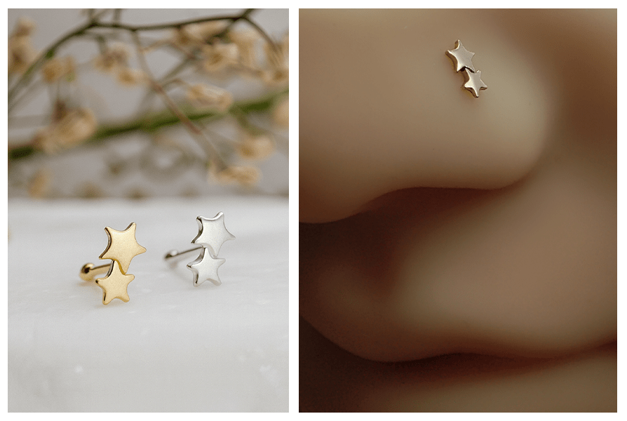 Dwa proste kolczyki do nosa z gwiazdkami w kolorze złotym i srebrnym na marmurowym tle oraz zbliżenie złotych gwiazdek w silikonowym skrzydełku nosa