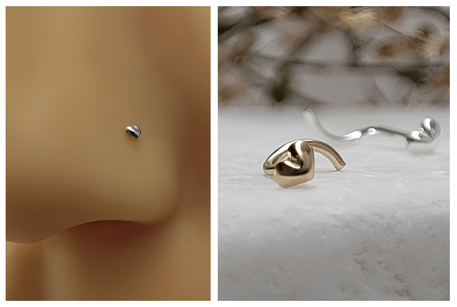 Srebrny zakręcony kolczyk do nosa z drobnym sercem założony w nosie oraz ujęcie złotego kolczyka w kształcie serduszka leżącego na jasnym kamieniu