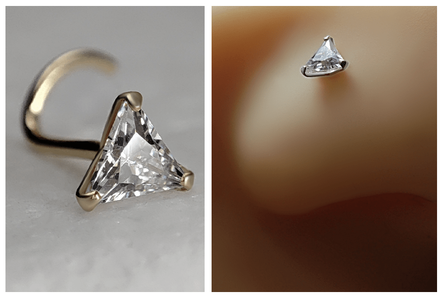 Zakręcony kolczyk do nosa z trójkątnym kryształem w srebrnej oprawie pokazany z bliska oraz ujęcie kolczyka w silikonowym nosie z profilu