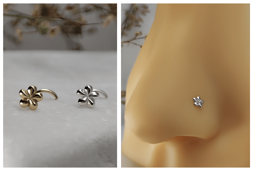 Para zakręconych kolczyków do nosa kwiatuszek w kolorze złotym i srebrnym ułożonych na marmurze oraz zbliżenie małego srebrnego kwiatu w piercingu nosa