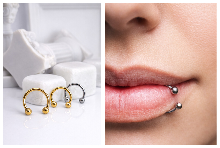 Dwie złote i jedna srebrna podkówka z kulkami na białym tle, a obok widać podkówkę założoną w dolnej wardze