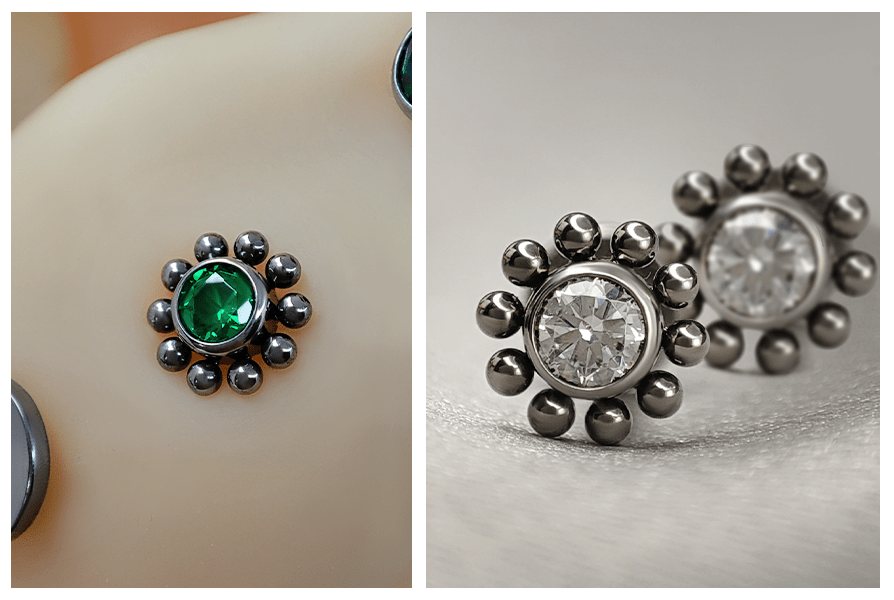Srebrny labret kwiatek z tytanu G23 – wersja z zielonym kamieniem w uchu oraz para z przejrzystym kryształem na tkaninie