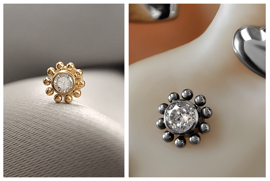 Labret kwiatek – złoty model z kryształkiem w zbliżeniu i srebrna wersja założona w uchu; delikatny, błyszczący efekt