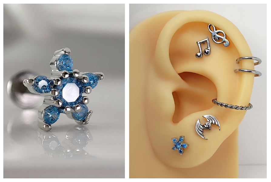 Srebrny labret w kształcie kwiatka z jasnoniebieskimi kryształkami, pokazany w dużym zbliżeniu oraz w stylizacji na silikonowym uchu
