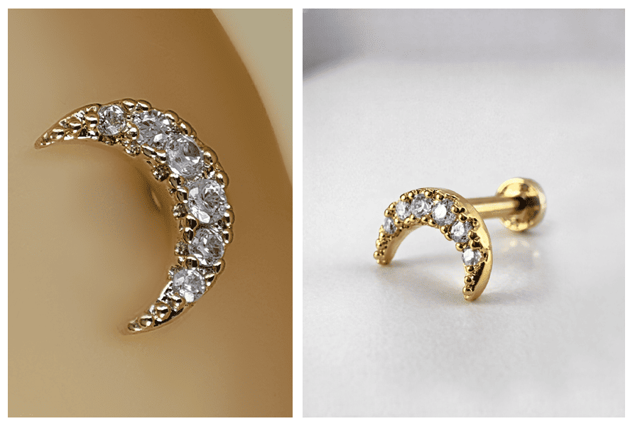 Złoty labret z błyszczącymi przezroczystymi kryształkami ułożonymi w kształt półksiężyca, zaprezentowany w zbliżeniu na uchu oraz na jasnym tle