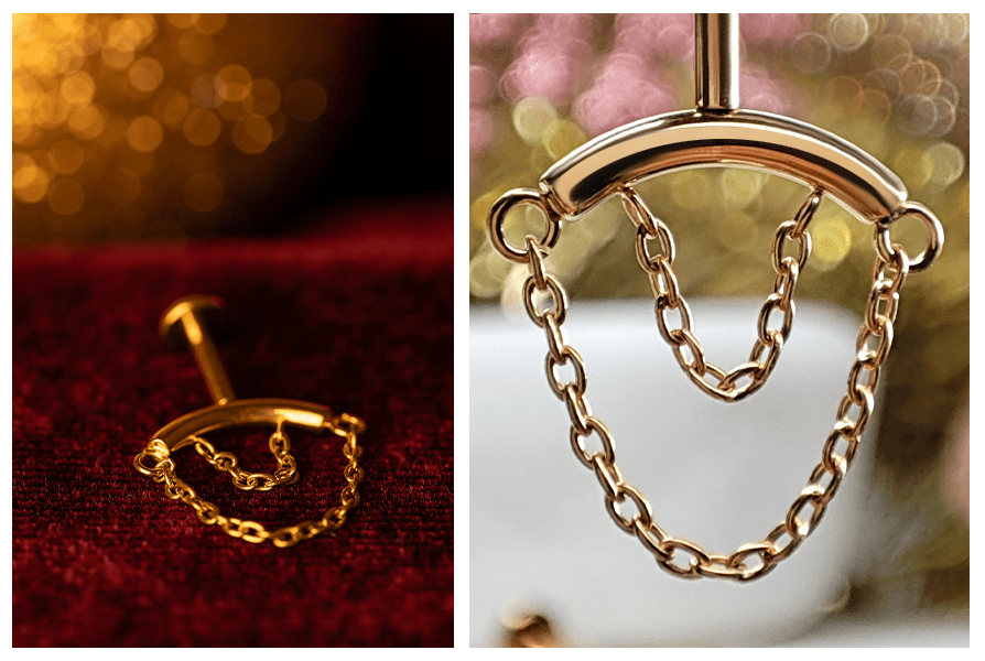 Kolczyk w kolorze złota z dwoma łańcuszkami leżący na czerwonym tle oraz makro detalu pokazujące ogniwa i podwójne zwisanie łańcuszków na belce (labret do vertical helix)