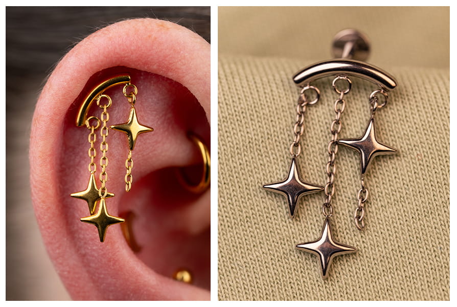 Złoty labret z trzema wiszącymi gwiazdkami w uchu oraz srebrny wariant kolczyka pokazany na zbliżeniu