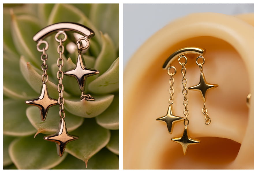 Złoty labret z trzema wiszącymi gwiazdkami w uchu oraz srebrny wariant kolczyka pokazany na zbliżeniu