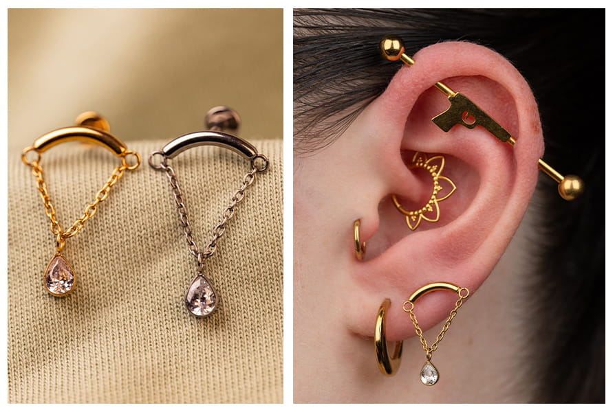 Labret z delikatnym łańcuszkiem i cyrkonią w kształcie łezki w złotej i srebrnej wersji, pokazany na jasnym tle oraz w stylizacji na uchu