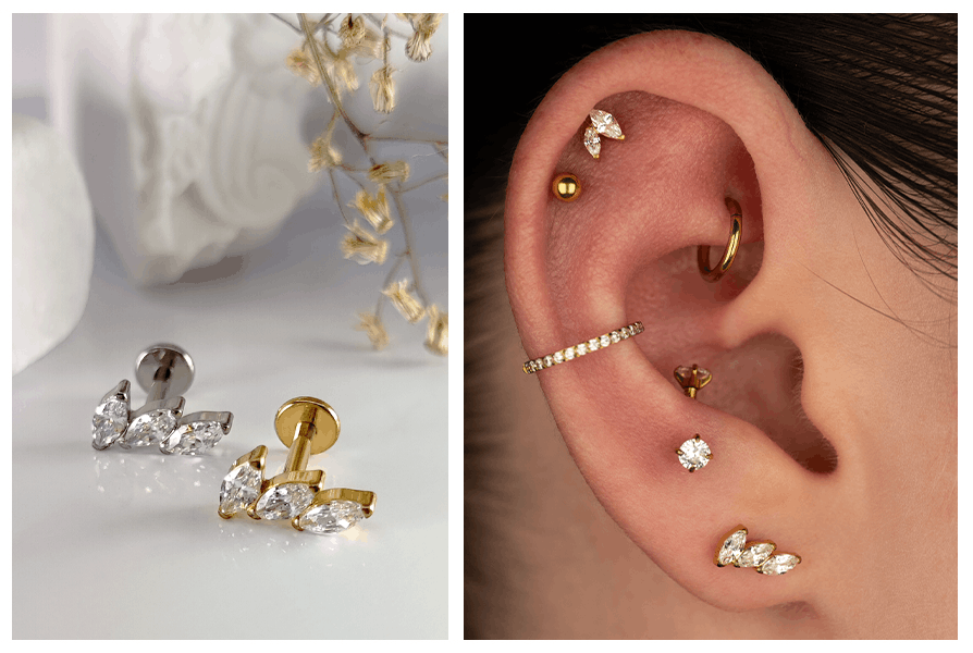 Złoty i srebrny labret z trzema cyrkoniami markizami obok ucha z bogatą kompozycją złotych kolczyków