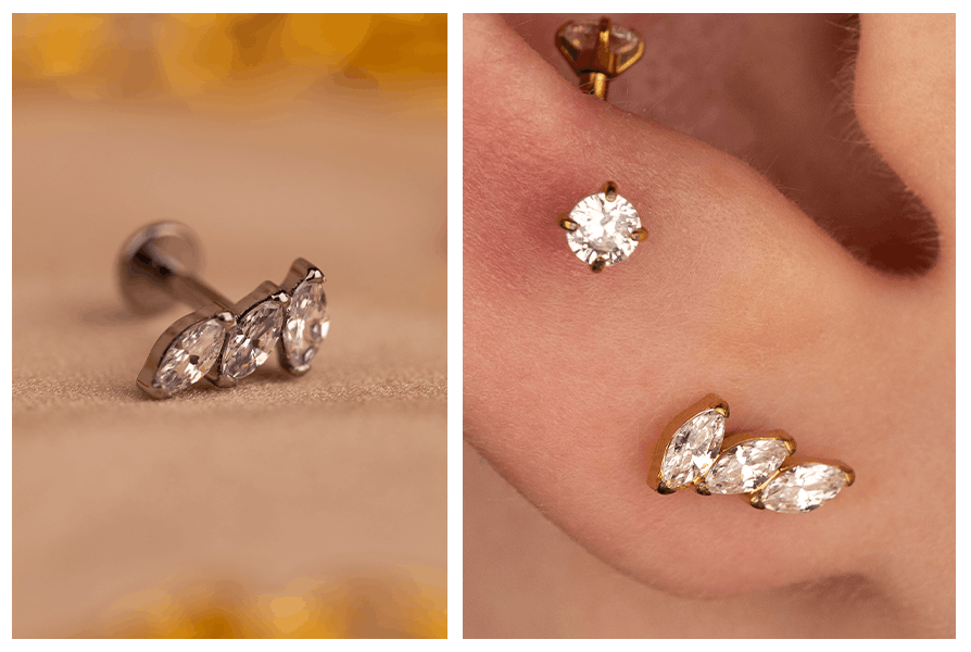 Zbliżenie na srebrny labret z trzema markizami oraz złoty kolczyk efektownie ułożony w płatku ucha