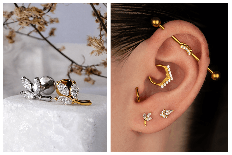 Złoty i srebrny labret z motywem trzech listków zaprezentowany obok ucha z kaskadą kolczyków