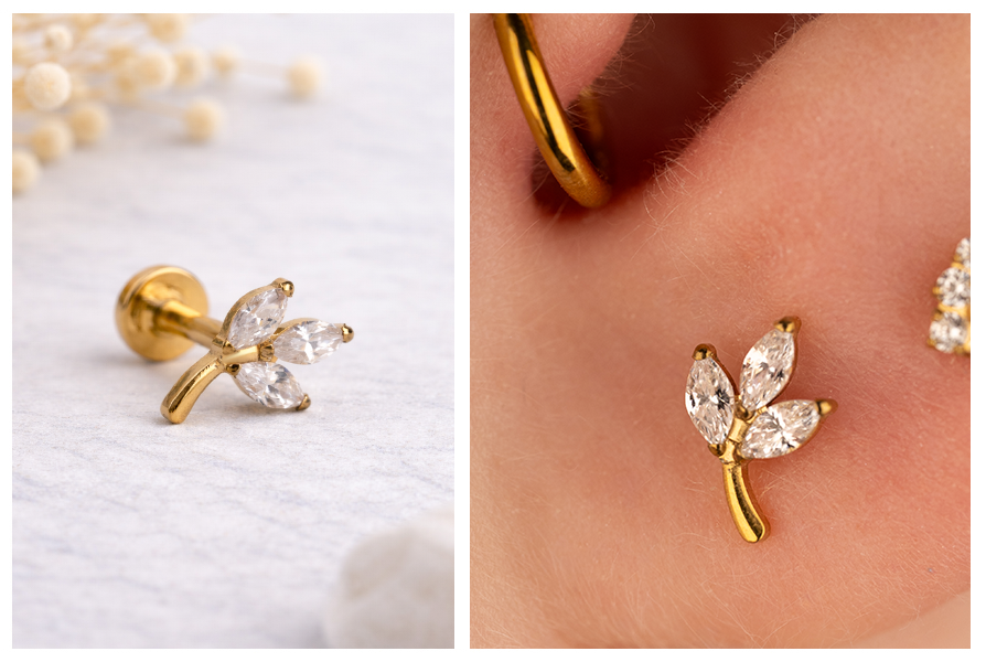 Bliskie ujęcie na precyzyjny szlif cyrkonii w kształcie listków w srebrnej oraz złotej wersji labretu