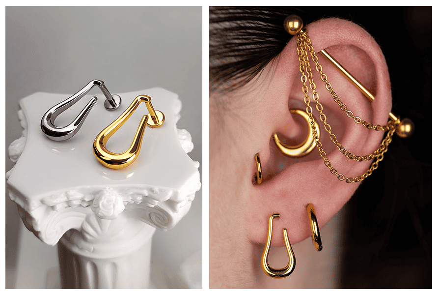 Złota i srebrna końcówka w kształcie otwartej łezki na jasnym tle oraz stylizacja ucha ze złotą biżuterią, gdzie widać labret z otwartą łezką