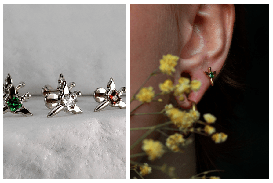 Trzy warianty labretu miecz z kryształkiem (zielony, przezroczysty i czerwony) pokazane obok siebie oraz przykład noszenia małego miecza z zielonym kamieniem w płatku ucha